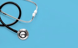 Stethoscope isolated on blue background. The stethoscope is a medical instrument for listening to the action of someone's heart or breathing. with copy space for your text.
