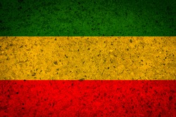 Green yellow red reggae background on concrete wall texture 