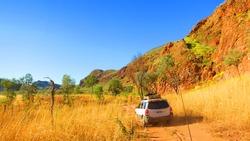Outback australia - road trip driving a 4x4 four wheel drive jeep off road through dirt track to camping spot near Lake Argyle - Ord River Irrigation Scheme; East Kimberley town of Kununurra