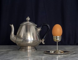 Sterling Silver Eggcup and Teapot Black Background Still Life