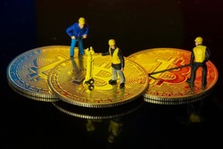 Concept of workers mining bit coin miniature people
