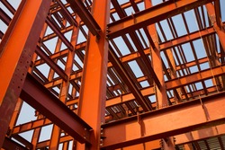 Red colored steel beam skeleton construction