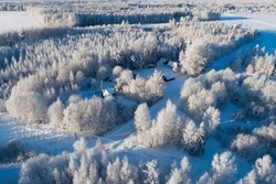 An aerial view of a frosty village landscape on a winter day in Estonia, Northern Europe	
