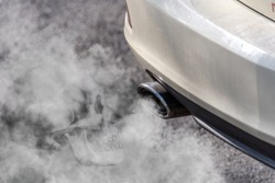 Car exhaust pipe coming out of the diesel exhaust. Exhaust gases are harmful to health - therefore a skull is incorporated into the exhaust gas cloud. Concept: transport or health protection