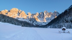 Sunset on the snow-covered Dolomites in Val Venegia, the small valley at the foot of the Pale di San Martino in the heart of the Unesco Dolomites Natural Park.

Trentino landscape with snowy mountain