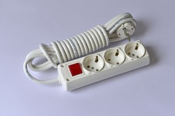 White extension cable with three plug socket and red switch