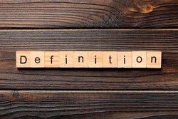 Definition word written on wood block. Definition text on wooden table for your desing, concept.