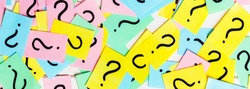 colorful paper notes with question marks. Closeup.