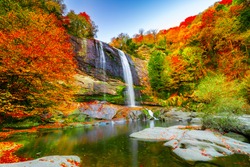 Waterfall view in autumn. The autumn colors surrounding the waterfall offer a visual feast. colorful leaves of autumn. Suuctu waterfalls, Bursa, Turkey.