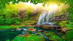 waterfall view in the forest. waterfall scene in spring. Nature landscape in forest. sun rays falling into the forest. nature landscape in summer. Uludag mountain national park, Bursa, Turkey.