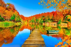 beautiful autumn landscape on the lake. Beautiful lake scenery with autumn leaves in colorful forest. Autumn colors in nature. Stunning nature landscapes. Beautiful forest lake view. Uludag, Turkey.
