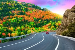 road landscape in autumn. Highway landscape in mountains with colorful trees. Nature scene in colorful autumn season. car driving on mountain road in forest. autumn travel in europe. Bavaria, Germany.