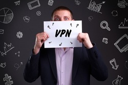 Business, technology, internet and network concept. Young businessman thinks over the steps for successful growth: VPN