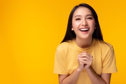Surprised happy beauty asian woman looking camera in excitement with happy and smile face. Expressive facial expressions. Beautiful girl act like a satisfied product Isolated on yellow background