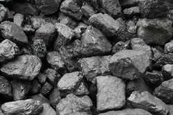 Pile of natural black hard coal for texture background. Best grade of metallurgical anthracite coals often referred to as stone coal and black diamond coal