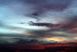 Blurry sunset sky background. Dramatic clouds at sunset sunrise. Skyscape and cloudscape backcgrounds. Nature abstract background.