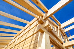 Construction of a house made of laminated veneer lumber. Construction of the roof of the house. Wooden house.