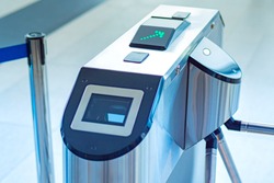 Entrance with e-pass. Turnstile spinner with a card application. Automatic checkpoint with contactless access. Turnstile with card reader. Electronic checkpoint. Access control system.