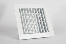 White plastic ventilation grille. Square ventilation grille on a white background. Creating a pleasant indoor climate. Ventilation grate for the air conditioner. Components for climate technology.