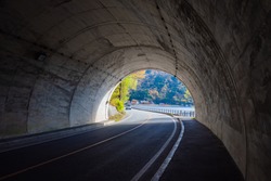 Japan. The tunnel leads to Lake Kawaguchiko. Departure from a tunnel on a highway in Japan. The end of the car tunnel in Fyuzhikavaguchiko. Road architecture of Japan. Trip to Kawaguchiko Lake