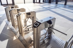 Electronic turnstile. Access system to the building. Pass through the passes. Security systems for rooms. Several turnstiles are installed nearby. Check Point. Automatic checkpoint. Building security.