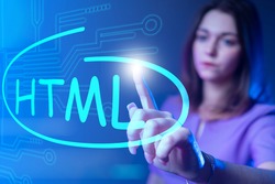 HTML code. Woman drew HTML logo on virtual screen. Website developer HTML5. Website development. Work website developer. Girl programmer web application. Programmer career. HyperText Markup Language