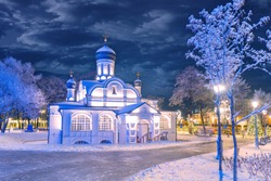 Moscow. Russia. Church on a winter evening. A small Church against a dark sky and snow-covered trees. Churches of Russia. Orthodoxy. Christmas eve. New year in the capital of Russia. Travel to Moscow