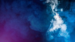 Smoky VAPE background. Vaper in a cloud of smoke. A man in a top hat and glasses smokes VAPE. Space for text. VAPE shop. E-cigarette smoker on a dark background.