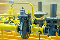 Gas control equipment. Natural gas supplies. Yellow pipeline. Regulators and pressure reducers on gas pipelines. Industrial equipment. Telemetry at the fuel company.
