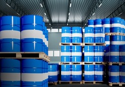 Chemical Barrels. Warehouse of chemical products. Metal barrels with crude oil. Chemistry industry warehouse. Pallets with barrels in industrial plant. Oil storage room. 