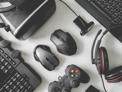top view of gaming gear, gamer space concept, with mouse, keyboard, headset, joystick, webcam, VR Headset on white background