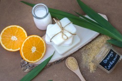 Natural body care milk soap, organic raw cane sugar scrub with grated orange peel.  Perfect for dry skin  Spa and massage ads poster, print or web design.  