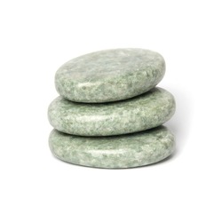 Three greenish polished jadeite stones for spa massage isolated on white background