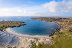 Aerial view on amazing Dog's bay beach near Roundstone town in county Galway, Sandy dunes and beach and blue turquoise color water. Cloudy sky. Popular travel destination. Gem of Connemara