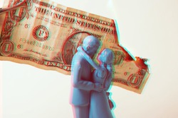 Vintage blue wedding cake topper couple in front of a dollar bill on fire. Weddings can be costly and a waste of money. Couple fighting over finances. Man and wife in financial trouble or divorce. 