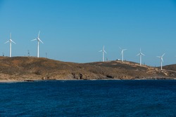 Wind turbines on the west coast of the Greek island of Psara in the North Aegean