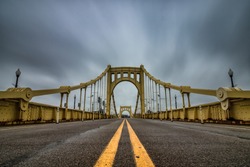 Yellow suspension bridge in Pittsburgh Pennsylvania. 