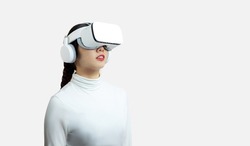 metaverse, woman in white shirt wearing vr glassess VR set equipment for Virtual Reality AI concept on the white background.