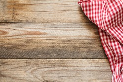 Cooking food / pizza wooden table background with red and white textile. Copy space for text