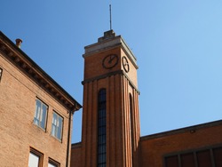 Ferrara, Italy. Alda Costa elementary school, detail of the clock tower.