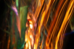 Abstract background of blurred stripes from salute and fireworks. Light multicolored effects.