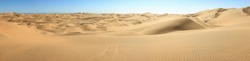 Big sand dunes panorama. Desert or beach sand textured background.