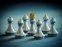 Silver chess pawn wear gold crown is surrounded by falling around silver chess pieces to fighting with teamwork to victory, business strategy concept and leader and teamwork concept for success.