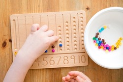 Montessori Beads Board. Learning to count and write numbers, prepare child for mental arithmetic, develop a sense of order, focus, coordination and accuracy.
