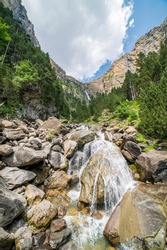 Cotatuero waterfall and river in the Ordesa and Monte Perdido National Park, Aragon, Huesca, Spain.