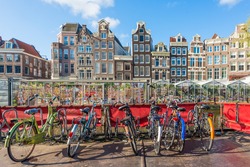 Many bicycle parking near flower market in Amsterdam, Netherlands. Bicycle is popular transportation in Amsterdam, Netherlands.