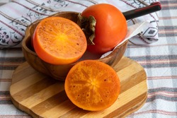 Persimmon. It is an edible fruit that grows on a variety of trees in the genus Diospyros. Turkish name is Trabzon Persimmon