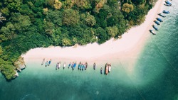 Aerial shot of Phra Nang beach in Thailand with long tail boats