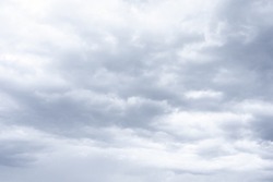 Cloudscape scenery, overcast weather above dark blue sky. Storm clouds floating in a rainy dull day with natural light. White and grey scenic environment background. Nature view.