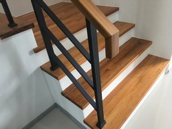 wood stair with black steel railing
